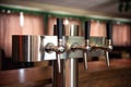 Beer tap in the bar, modern metal cider draft taps in a row Royalty Free Stock Photo