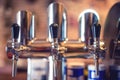 Beer tap at restaurant, bar or pub. Close-up details of beer draft taps in a row Royalty Free Stock Photo