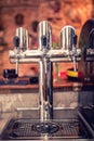 Beer taps at restaurant, bar, pub or bistro. Close-up details of beer draft taps in a row on barman counter in bar