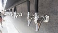 Beer taps silver shinny black handle, ready to pour, Royalty Free Stock Photo