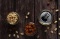 beer in a tin can on a wooden background with crackers and peanuts top view Royalty Free Stock Photo