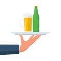 Beer on a tray. Glass of beer men holding in hand. Vector flat