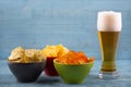 Beer and various types of chips Royalty Free Stock Photo