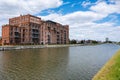 Beersel, Flemish Brabant Region, Belgium - An old mill house, now transformed into lofts and offices at the banks of the canal