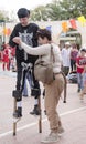 Beersheba, Israel. March 24,Mother helps her son to walk on stilts. Purim