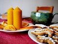 Beeswax candles, dried oranges and gingerbread Royalty Free Stock Photo