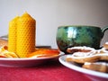 Beeswax candles and tea cup Royalty Free Stock Photo