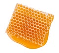 Beeswax honeycomb piece of liquid yellow natural honey isolated on white background Royalty Free Stock Photo