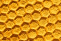 Beeswax pattern, golden honeycomb with a hexagon cell shape, beehive macro