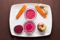 Beet apple ginger and carrot juice Royalty Free Stock Photo
