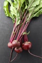 Beet, beetroot bunch on black stone background. Copy space Royalty Free Stock Photo