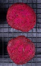 Beet burgers on the metallic lattice Royalty Free Stock Photo