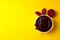 Beet cream soup on yellow background Royalty Free Stock Photo