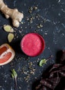 Beet and Ginger Detox Elixir. On a dark background Royalty Free Stock Photo