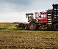 beet harvester with belt loading in the process of harvesting Royalty Free Stock Photo