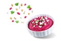 Beet hummus appetizer in a white bowl on a white isolated background