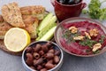 Beet hummus with olives and bread