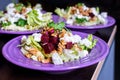 Beet salad with goat cheese, walnuts, greens and herbs and olive oil. Royalty Free Stock Photo