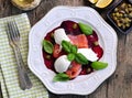 Beet salad, soft cheese and smoked salmon with capers and olive oil. Royalty Free Stock Photo