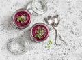 Beet soup in glass jars on a light background. Royalty Free Stock Photo