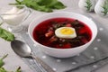 Beet soup with sorrel and egg in a white bowl Royalty Free Stock Photo