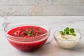 Beet soup and sour cream with fresh cilantro close up in a glass bowls Royalty Free Stock Photo