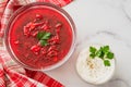 Beet soup and sour cream with fresh cilantro close up in a glass bowls Royalty Free Stock Photo