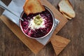 Beetroot cream soup in bowl with cheese , sour cream and bread on a rustic wooden background. Top view, flat lay Royalty Free Stock Photo