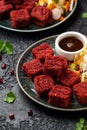 Beetroot and hazelnut bites with pomegranate glaze, vegetarian, vegan party finger food Royalty Free Stock Photo