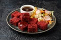 Beetroot and hazelnut bites with pomegranate glaze, vegetarian, vegan party finger food Royalty Free Stock Photo