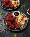 Beetroot and hazelnut bites with pomegranate glaze, vegetarian, vegan party finger food Royalty Free Stock Photo