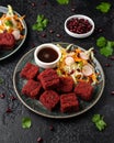 Beetroot and hazelnut bites with pomegranate glaze, vegetarian, vegan party finger food Royalty Free Stock Photo