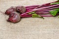 Beetroot on hessian on rustic wooden table Royalty Free Stock Photo
