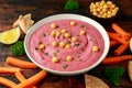 Beetroot Hummus with chickpea, olive oil, lemon, carrots and pita bread Royalty Free Stock Photo