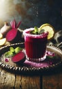 Beetroot juice in a glass and fresh organics beetroot with lemon and mint leaves on rustic wooden table Royalty Free Stock Photo