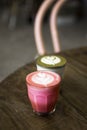 Beetroot, matcha latte on the wooden table background.