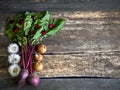 Beetroot onion garlic heart on wooden table, closeup