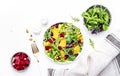 Beetroot and orange salad with arugula, lamb lettuce, mini chard and pistachios, white table, copy space.. Fresh useful dish for