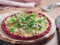Beetroot pizza crust with fresh mangold leaves Royalty Free Stock Photo