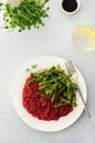 Beetroot risotto with rice and sesame seeds, baked asparagus with microgreens Royalty Free Stock Photo