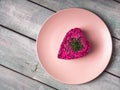 Beetroot salad in the shape of a heart on a pink plate Royalty Free Stock Photo