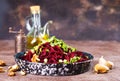 Beetroot salad with wallnuts and garlic in bowl on wooden table. Selective focus