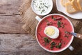 Beetroot soup with egg close up. horizontal top view Royalty Free Stock Photo