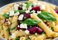 Beetroot, Spinach, and Feta Pasta Delight with a Crunch of Walnuts Royalty Free Stock Photo