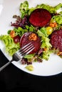 Beetroot steak salad with blue cheese sauce, grapes and walnuts