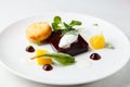 Beetroot terrine, goat cheese croquettes, horseradish sauce and dill cream on white dish Royalty Free Stock Photo