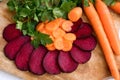 Beets,carots and parslay on a kitchen board Royalty Free Stock Photo