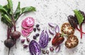 Beets, red cabbage, tomatoes, beans, peppers, onions, Swiss chard on a light background, top view. Food vegetables background.