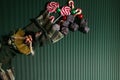 Befana sock with sweet coal and candy on dark greeen background. Italian Epiphany day tradition.