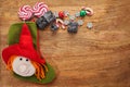 Befana sock with sweet coal and candy on wooden background. Italian Epiphany day tradition. Royalty Free Stock Photo